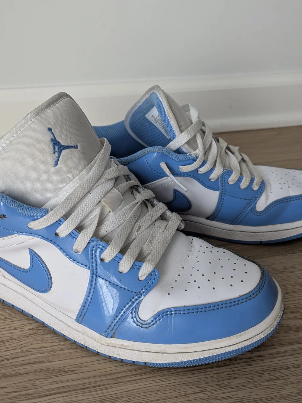 Jordan Men’s Low Top Sneakers in White & University Blue